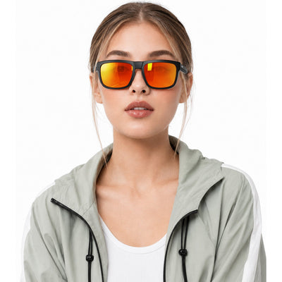 Juno side-shield wrap sunglasses in Orange / Black, orange lens on black frame, worn, front view