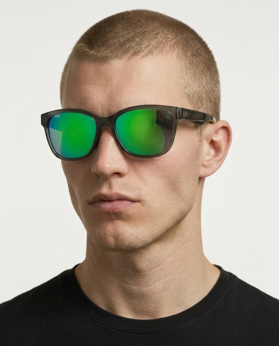 Delta 9 oversized round sunglasses in Green / Smoke Grey, green lens on smoke grey frame, worn by a man, front view