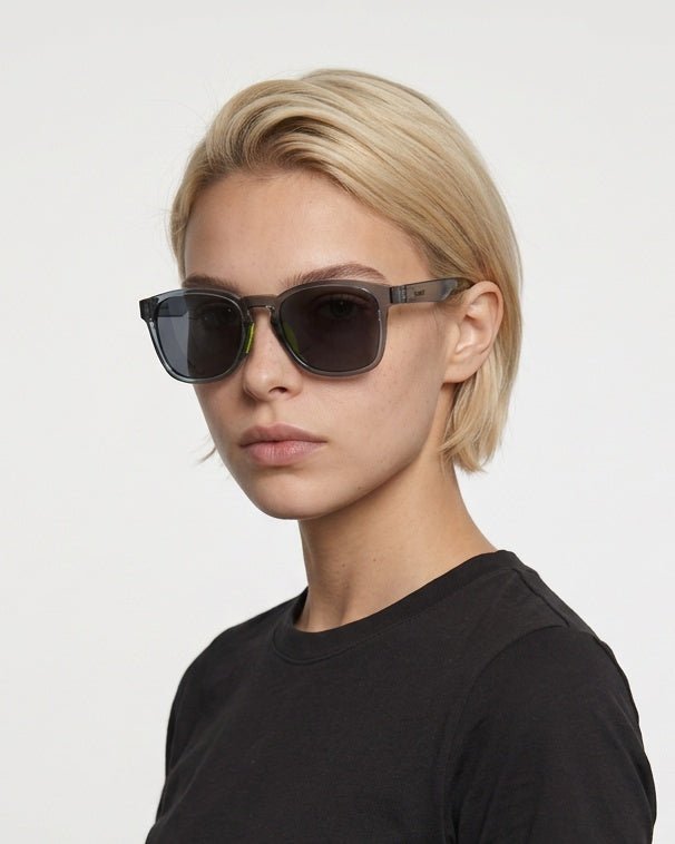 Loft square sunglasses in Black / Black, black lens on black frame, worn by a woman, front view