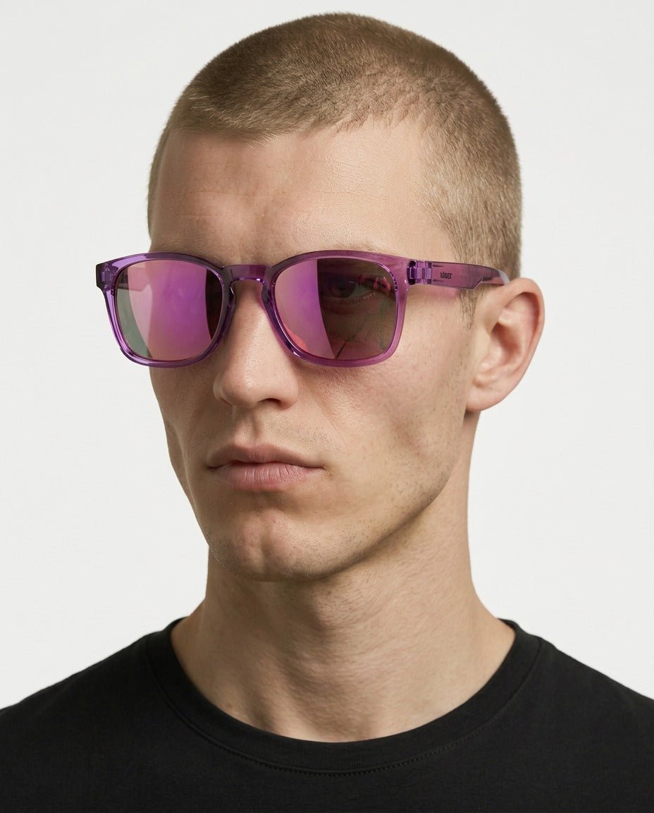 Loft square sunglasses in Pink / Clear Pink, pink lens on clear pink frame, worn by a man, front view