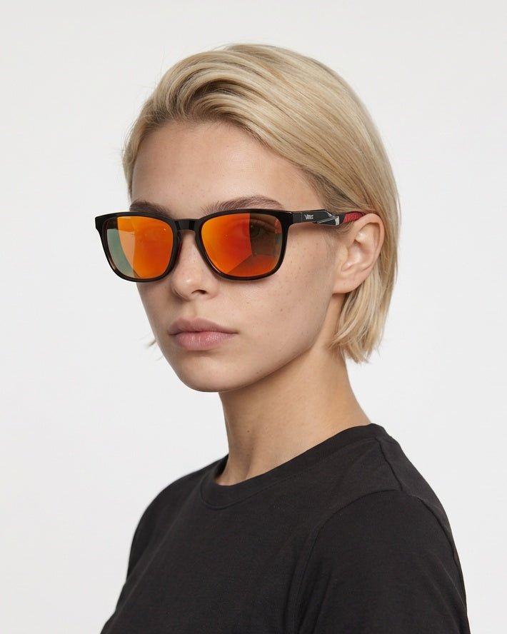 Marlow square sunglasses in Orange / Black, orange lens on black frame, worn by a woman, front view