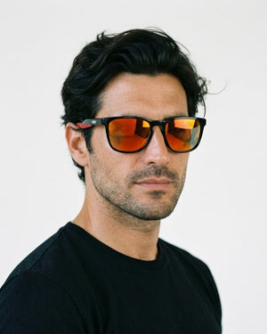 Marlow square sunglasses in Orange / Black, orange lens on black frame, worn by a man, front view