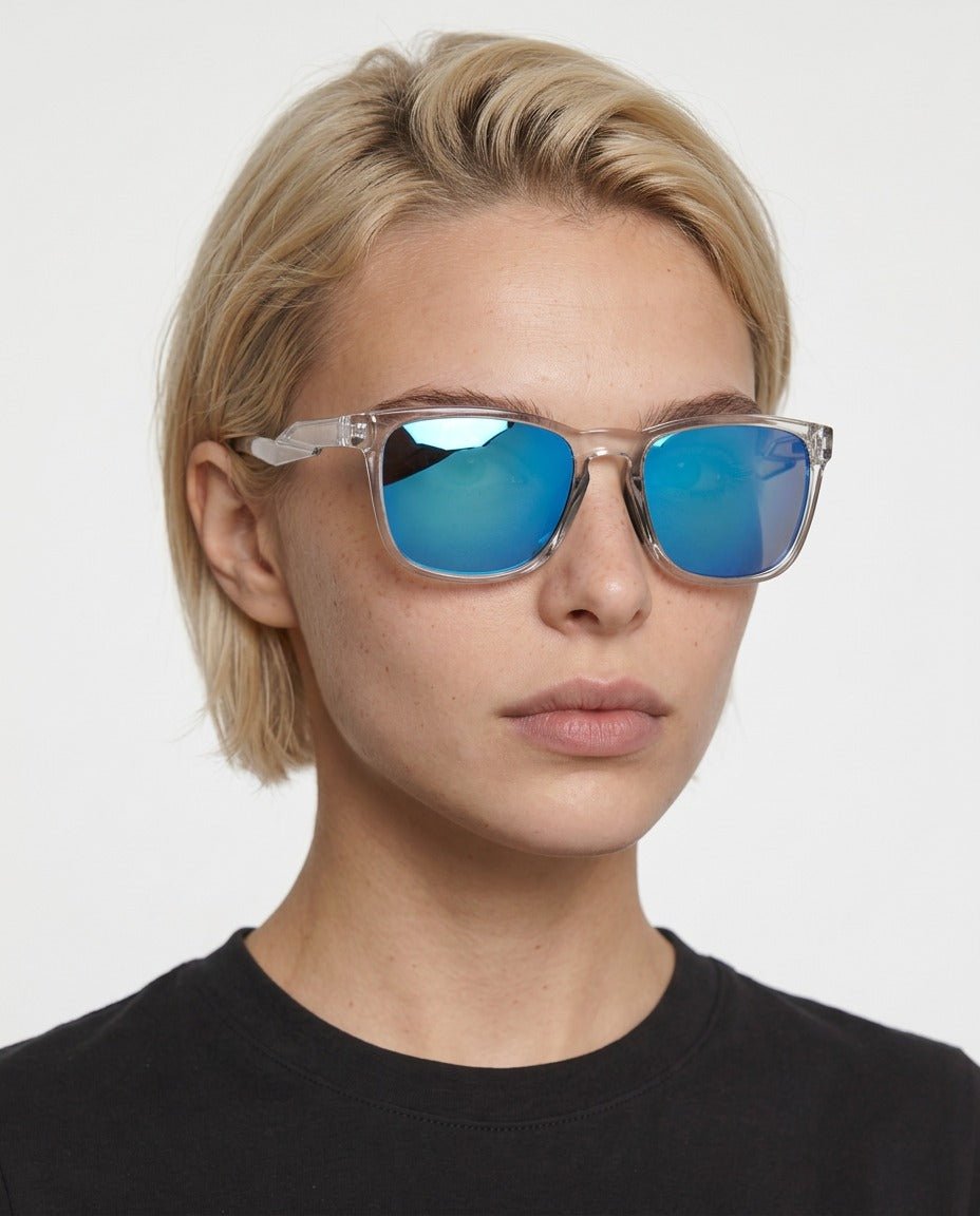 Marlow square sunglasses in Blue / Clear, blue lens on clear frame, worn by a woman, front view