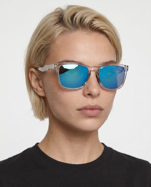 Marlow square sunglasses in Blue / Clear, blue lens on clear frame, worn by a woman, front view