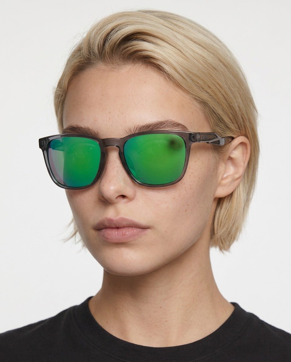 Marlow square sunglasses in Green / Smoke Grey, green lens on smoke grey frame, worn by a woman, front view