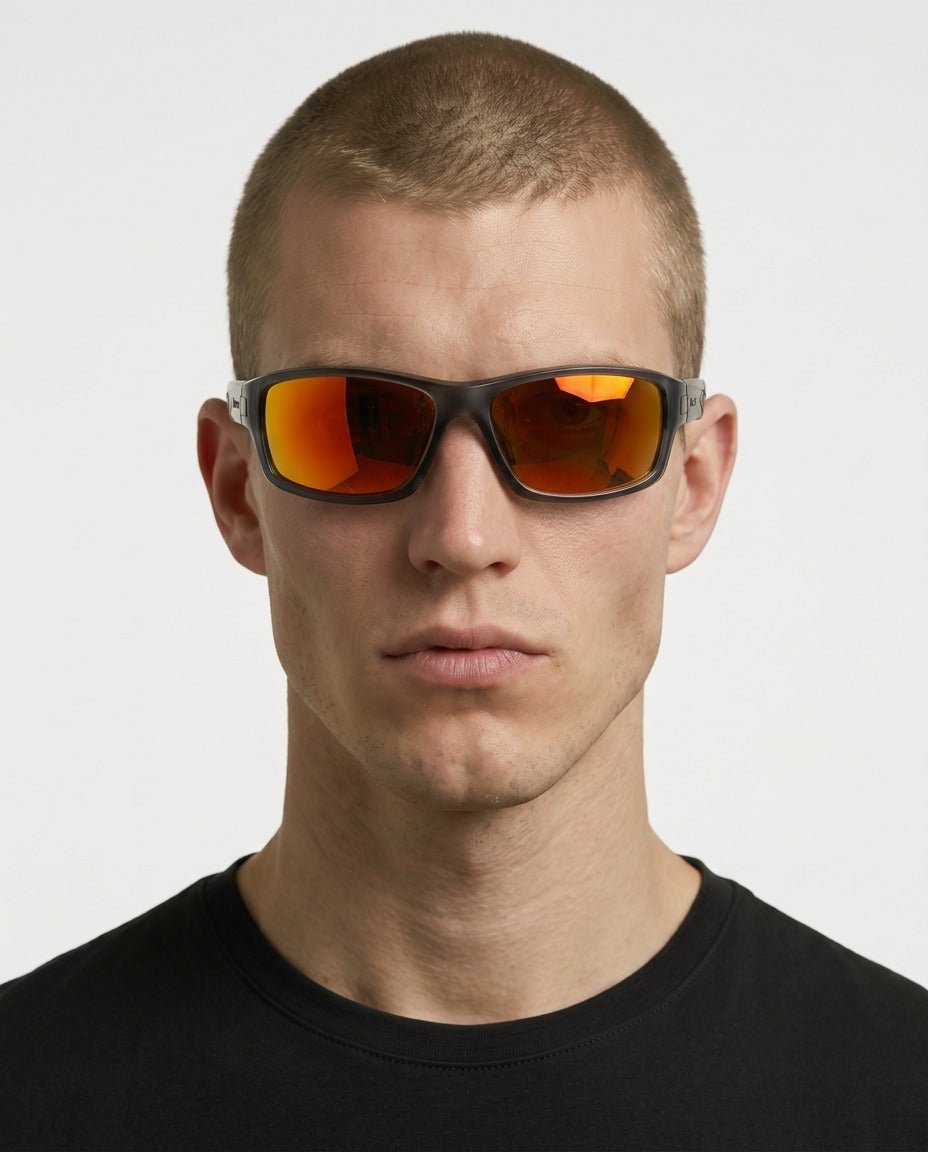 Nova sport wrap sunglasses in Orange / Smoke Grey, orange lens on smoke grey frame, worn by a man, front view