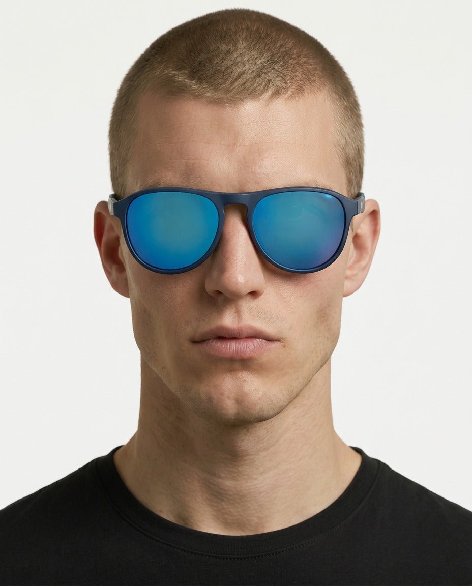 Orbit rounded aviator sunglasses in Blue / Blue, blue lens on blue frame, worn by a man, front view