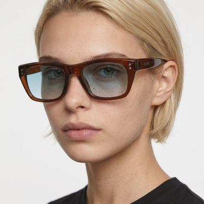Riviera rectangle acetate sunglasses in Light Blue / Brown, light blue lens on brown frame, worn by a woman, front view