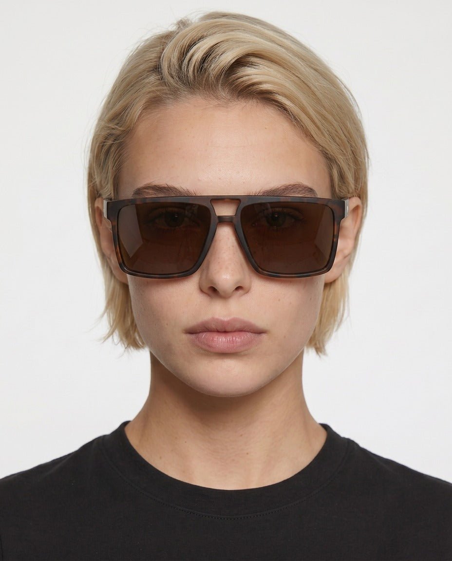 Sasha flat-top square sunglasses in Tea / Tortoise, tea lens on tortoise frame, worn by a woman, front view