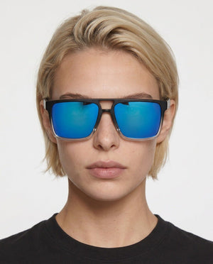 Sasha flat-top square sunglasses in Blue / Black/Clear, blue lens on black/clear frame, worn by a woman, front view