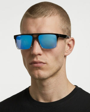 Sasha flat-top square sunglasses in Blue / Black/Clear, blue lens on black/clear frame, worn by a man, front view