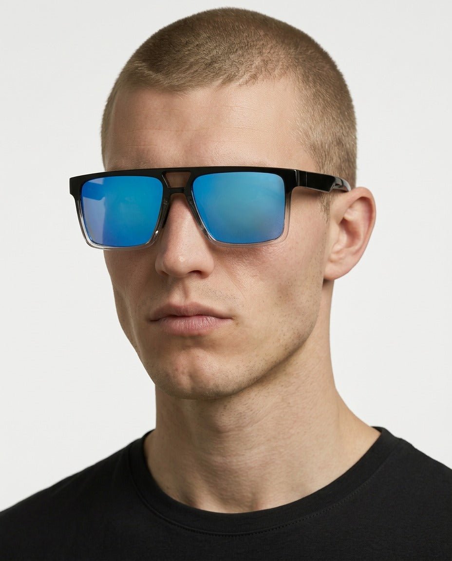 Sasha flat-top square sunglasses in Blue / Black/Clear, blue lens on black/clear frame, worn by a man, front view