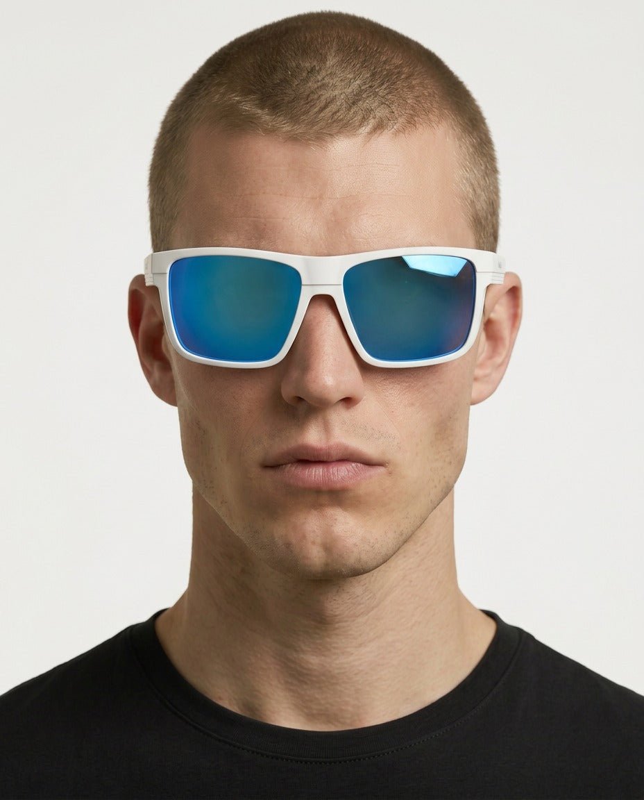 Theo bold wrap sunglasses in Blue / White, blue lens on white frame, worn by a man, front view