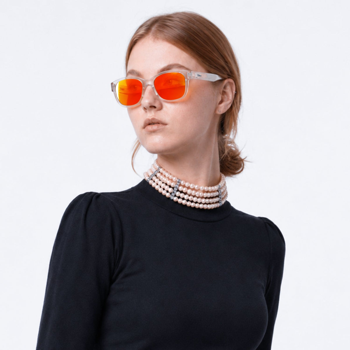 Delta 9 oversized round sunglasses in Orange / Clear, orange lens on clear frame, worn, side view
