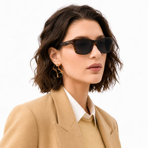 Flux sport wrap sunglasses in Black / Tortoise, black lens on tortoise frame, worn, side view