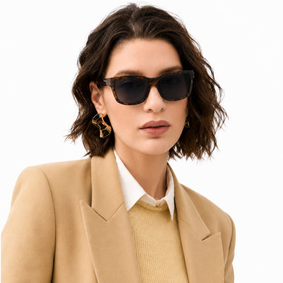 Flux sport wrap sunglasses in Black / Tortoise, black lens on tortoise frame, worn, front view