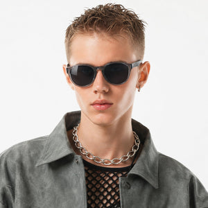 Hollis retro round sunglasses in Grey / Clear Grey, grey lens on clear grey frame, worn, front view