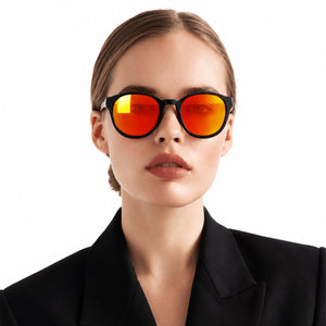 Hollis retro round sunglasses in Orange / Black, orange lens on black frame, worn, front view