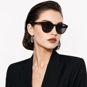 Hollis retro round sunglasses in Black / Tortoise, black lens on tortoise frame, worn, side view