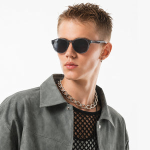 Hollis retro round sunglasses in Grey / Clear Grey, grey lens on clear grey frame, worn, side view