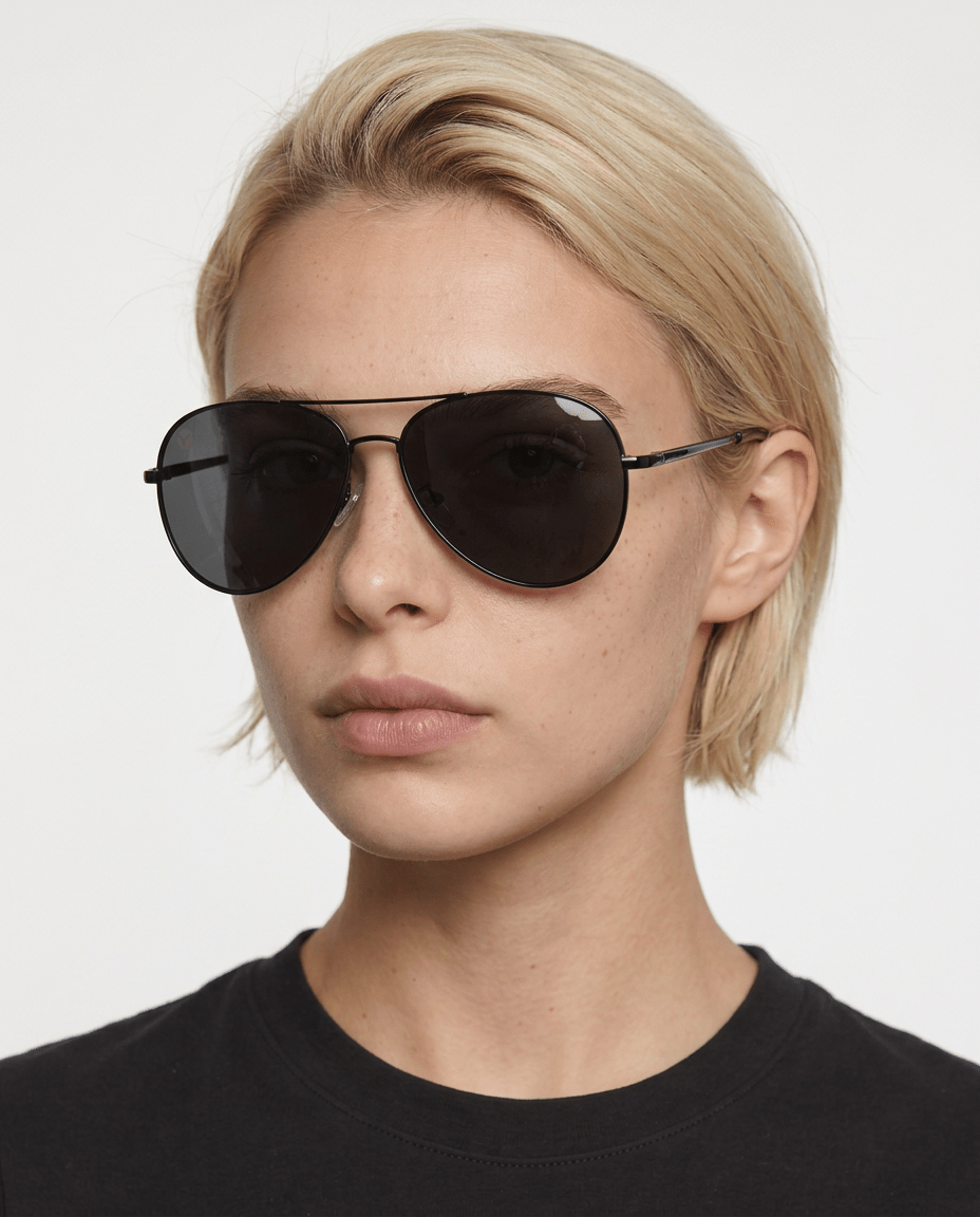 Nexus metal aviator sunglasses in Grey / Black, grey lens on black frame, worn by a woman, front view
