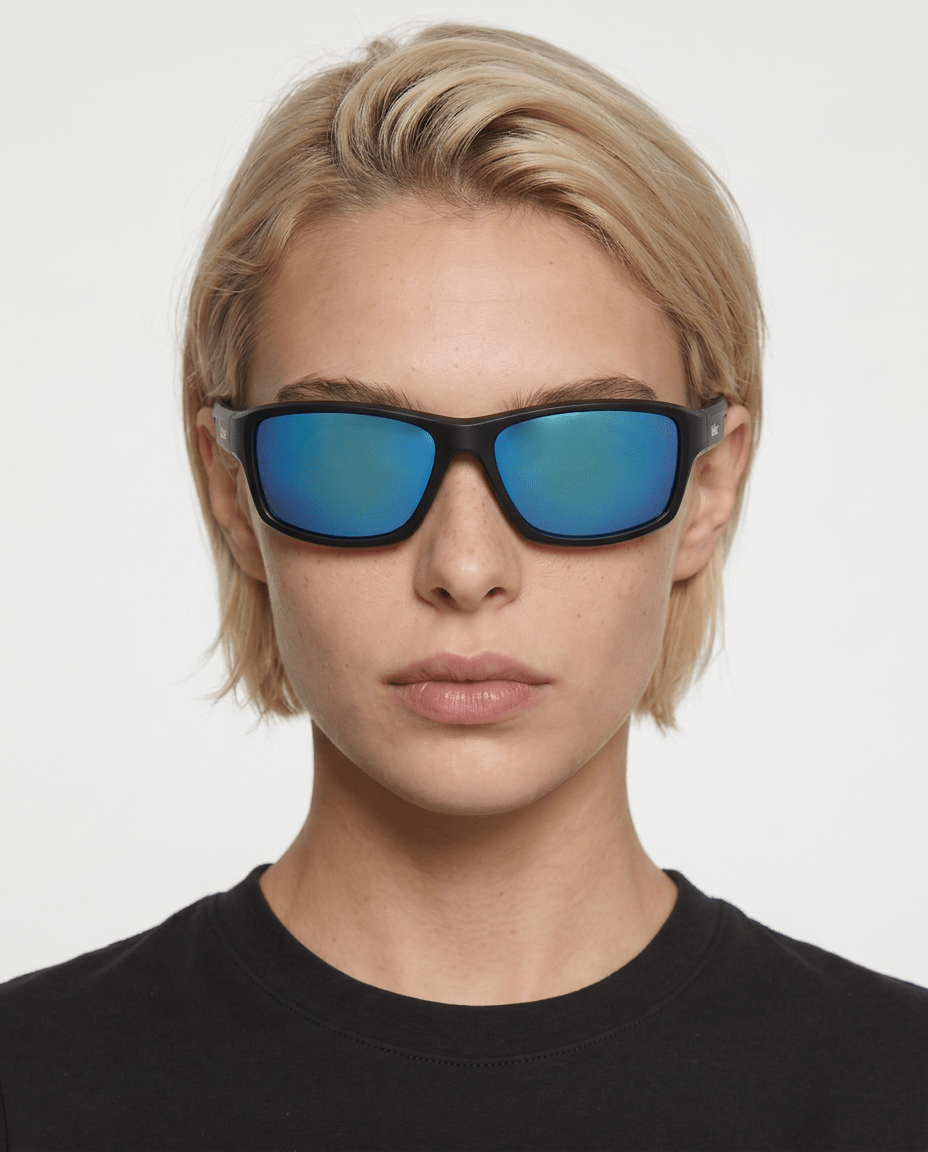 Nova sport wrap sunglasses in Blue / Black, blue lens on black frame, worn by a woman, front view
