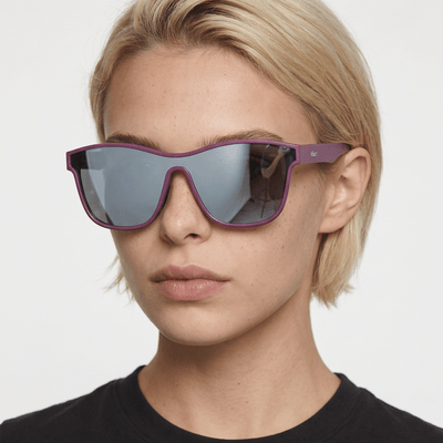 Radar performance wrap sunglasses in Silver / Purple, silver lens on purple frame, worn by a woman, front view