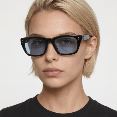Riviera rectangle acetate sunglasses in Blue / Black, blue lens on black frame, worn by a woman, front view