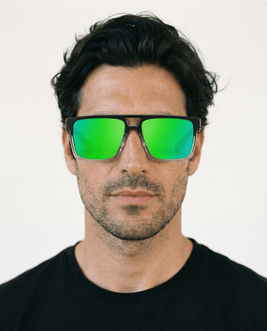 Sasha flat-top square sunglasses in Green / Black, green lens on black frame, worn by a man, front view