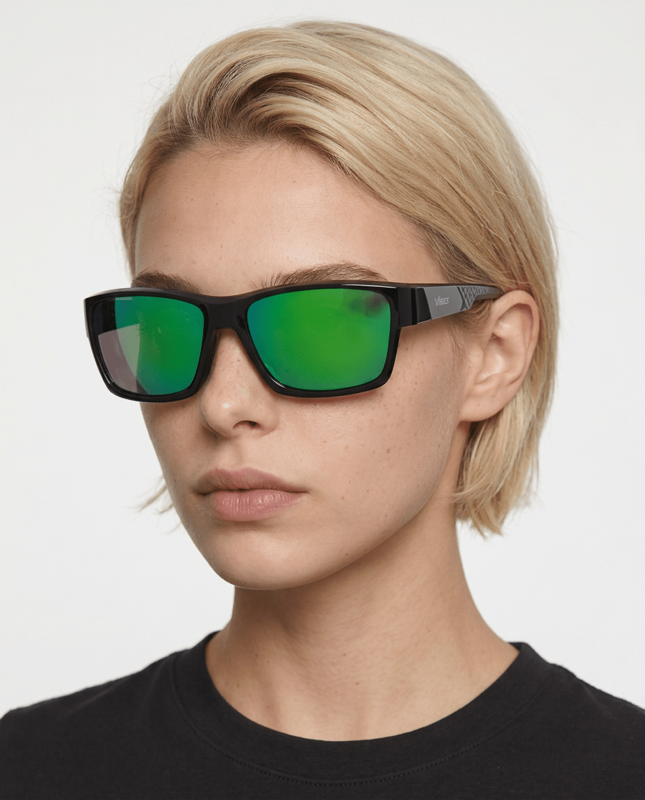 Specter slim wrap sunglasses in Green / Black, green lens on black frame, worn by a woman, front view