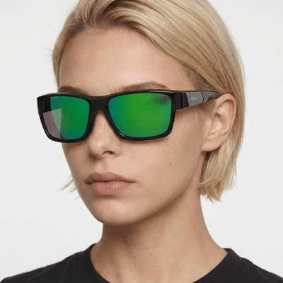 Specter slim wrap sunglasses in Green / Black, green lens on black frame, worn by a woman, front view