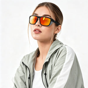 Juno side-shield wrap sunglasses in Orange / Black, orange lens on black frame, worn, side view