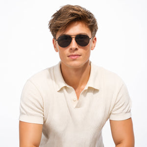 Nexus metal aviator sunglasses in Grey / Black, grey lens on black frame, worn, front view