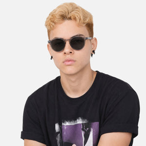 Onyx round retro sunglasses in Black / Clear Grey, black lens on clear grey frame, front view