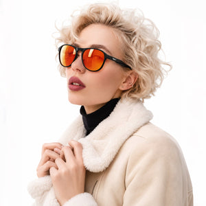 Orbit rounded aviator sunglasses in Orange / Black, orange lens on black frame, worn, side view