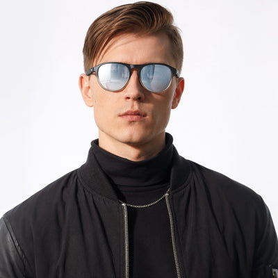 Orbit rounded aviator sunglasses in Silver / Black, silver lens on black frame, worn, front view
