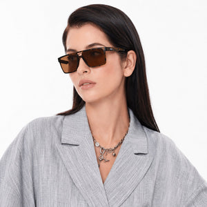 Sasha flat-top square sunglasses in Tea / Tortoise, tea lens on tortoise frame, worn, side view