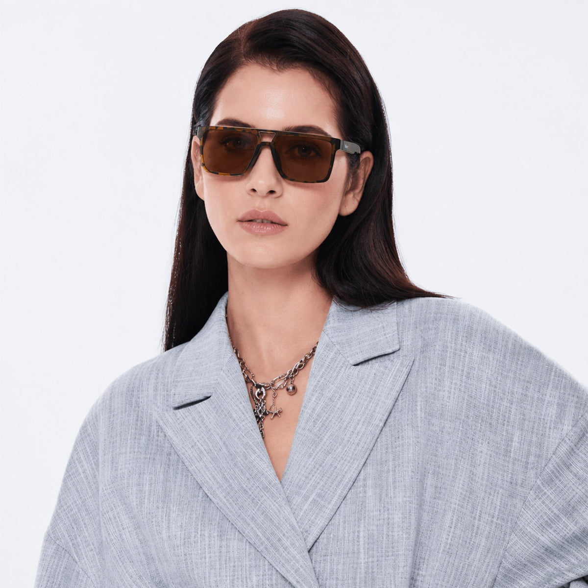 Sasha flat-top square sunglasses in Tea / Tortoise, tea lens on tortoise frame, worn, front view