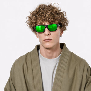 Specter slim wrap sunglasses in Green / Black, green lens on black frame, worn, front view