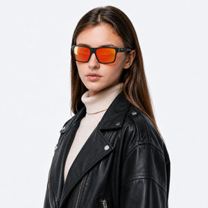 Theo bold wrap sunglasses in Orange / Black, orange lens on black frame, worn, side view